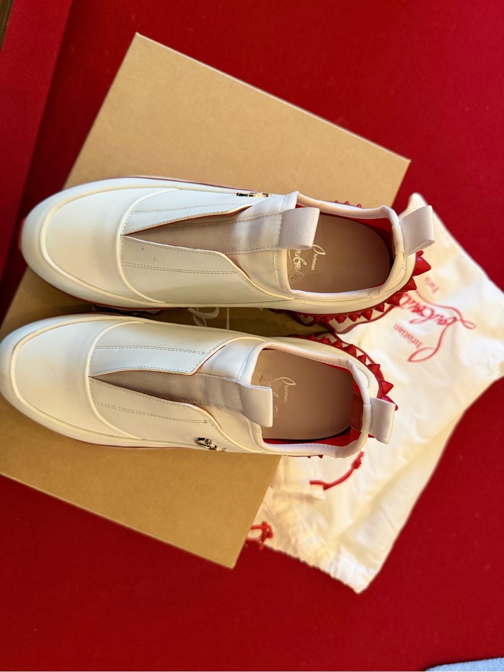 Christian Louboutin White Slip-On Sneakers with Red Spike Trim